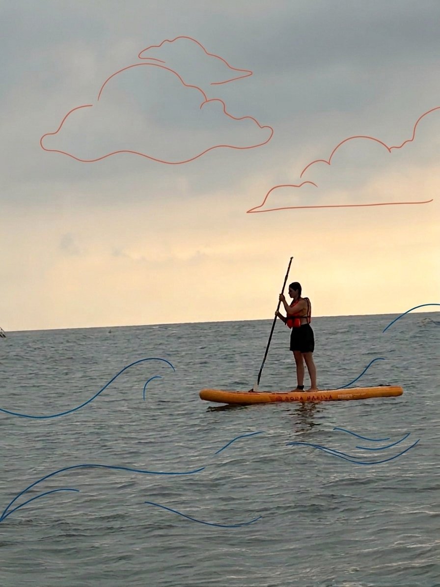 Paddleboarding at Soli Pompeiopolis Paddleboarder on an inflatable SUP in calm golden-hour water off Mezitli beach near Soli Pompeiopolis, Mersin