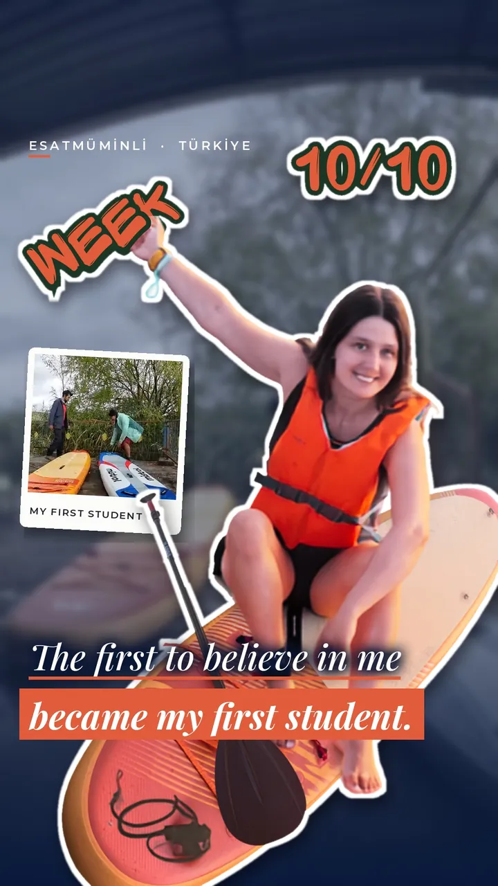 Home Deniz Ulaşan kneeling on a paddleboard in a life jacket, arm raised, after teaching her first SUP student